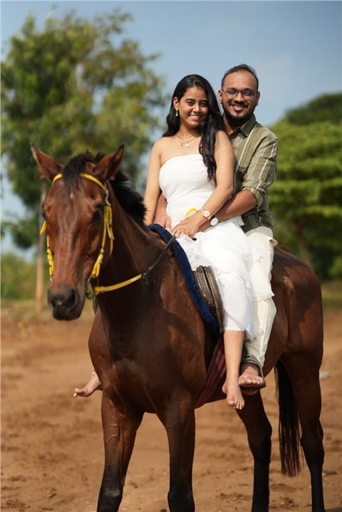 Akshay and Hansa smiling together on horseback