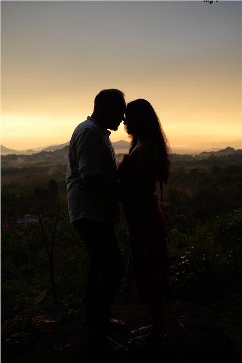 Akshay and Hansa silhouetted together at sunset